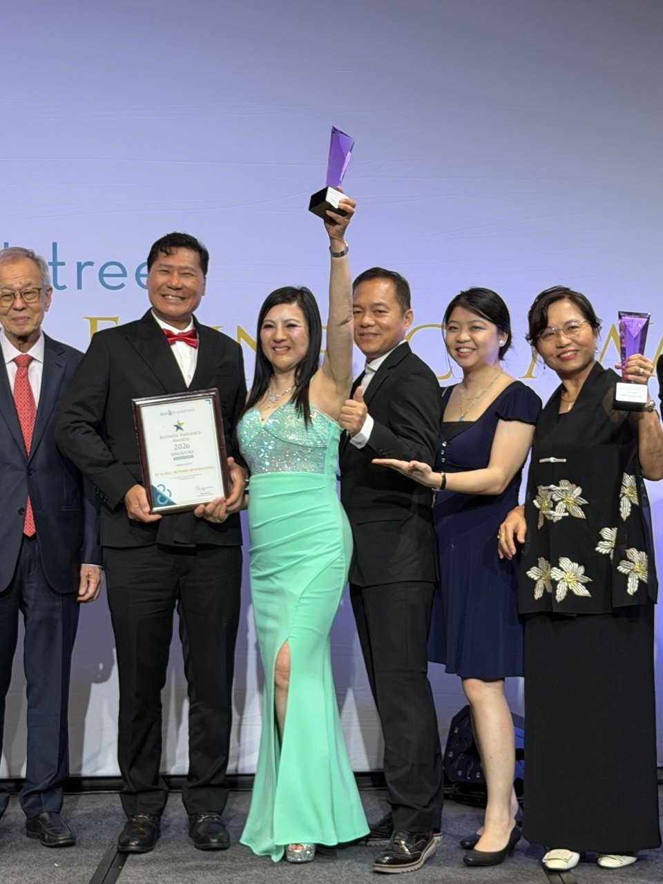 The Business Eminence Awards 2026 certificate presented to CE GLOBAL NETWORK (INTERNATIONAL), held on stage
