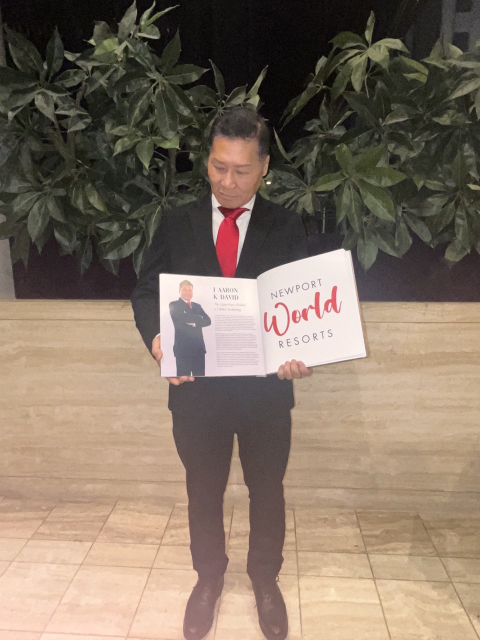 J AARON K DAVID holding his Manila Up Magazine feature spread