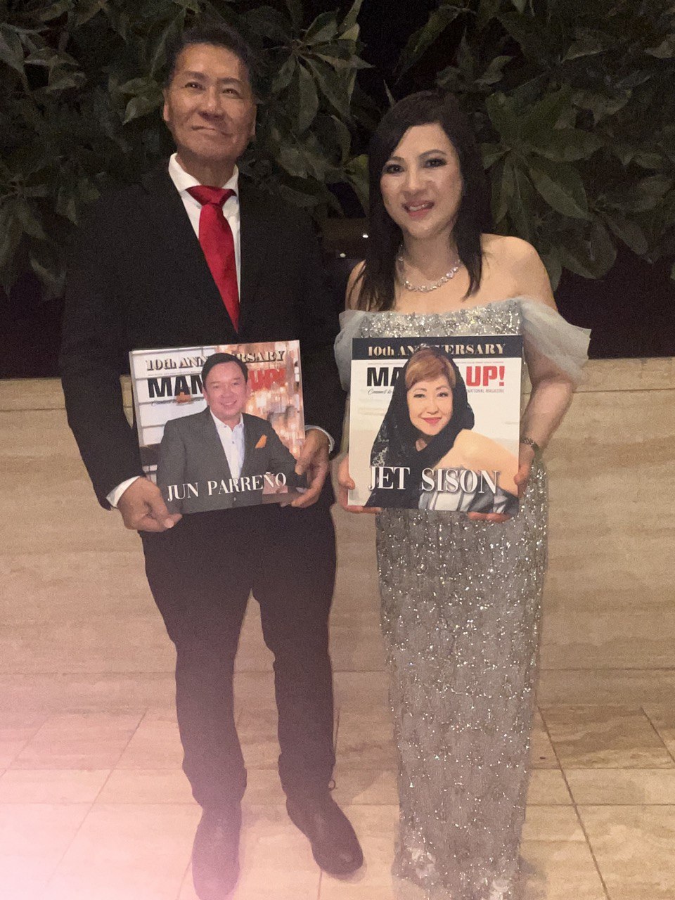 SHEKINAIH SIEW SIN YAP and J AARON K DAVID holding Manila Up 10th Anniversary magazine covers