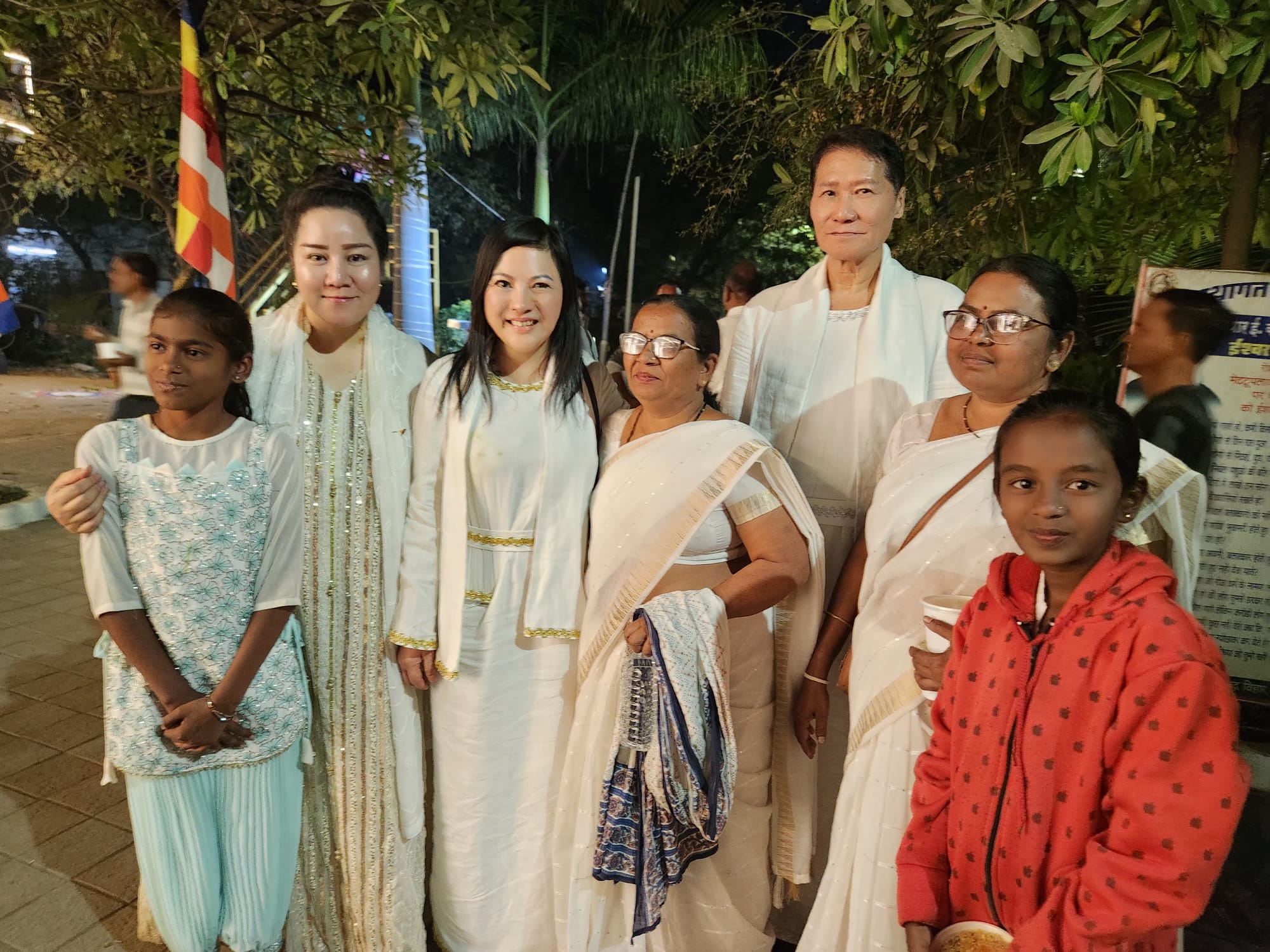 SHEKINAIH SIEW SIN YAP and J AARON K DAVID with local families and children at the Nagpur food distribution