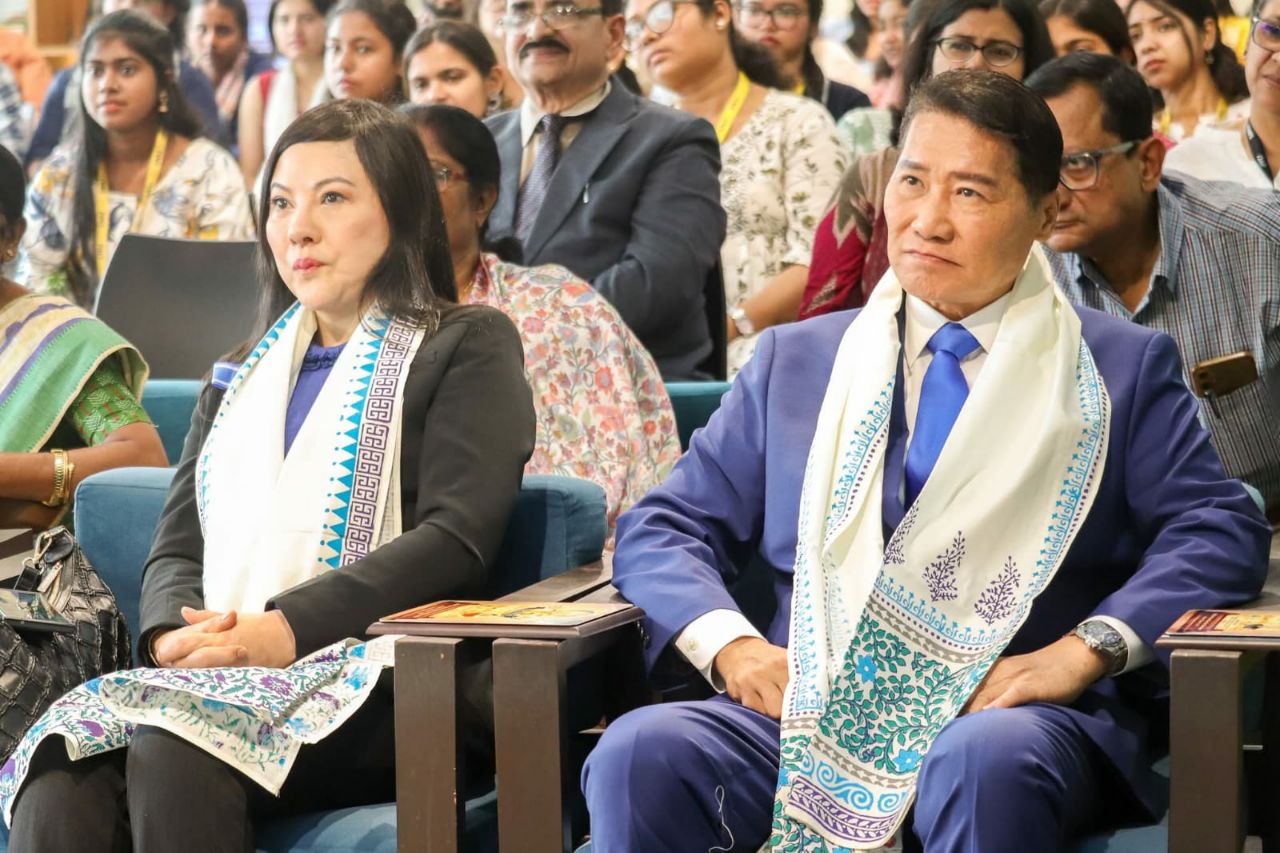SHEKINAIH SIEW SIN YAP and J AARON K DAVID seated as Guests of Honour at the Maghi Purnima symposium, Kolkata