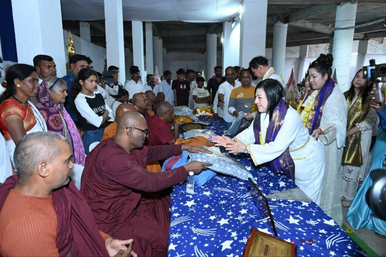 SHEKINAIH SIEW SIN YAP personally offering monk robes to seated Buddhist monks at Tathagat Buddha Vihar, Nagpur