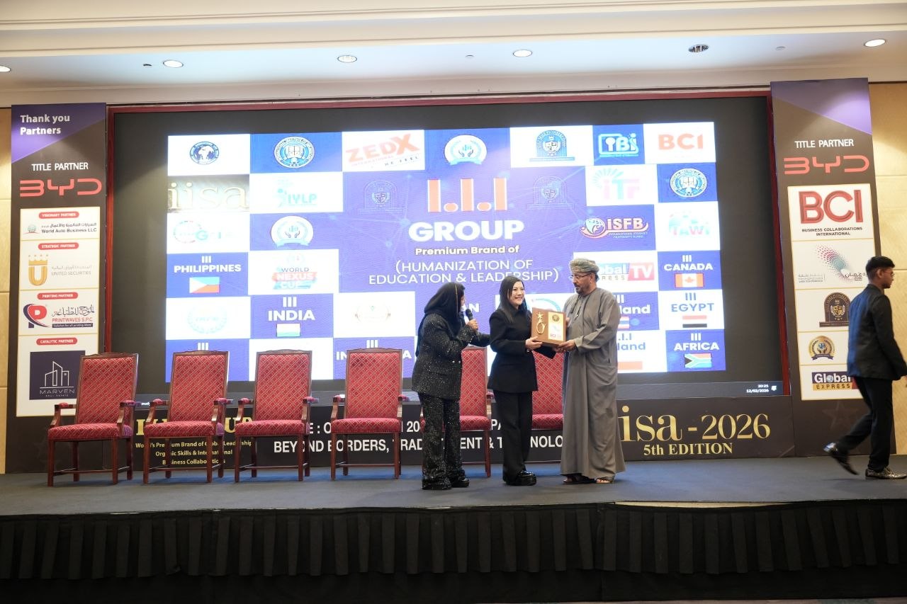 SHEKINAIH SIEW SIN YAP receiving the IISA 2026 award plaque from the Omani official on stage