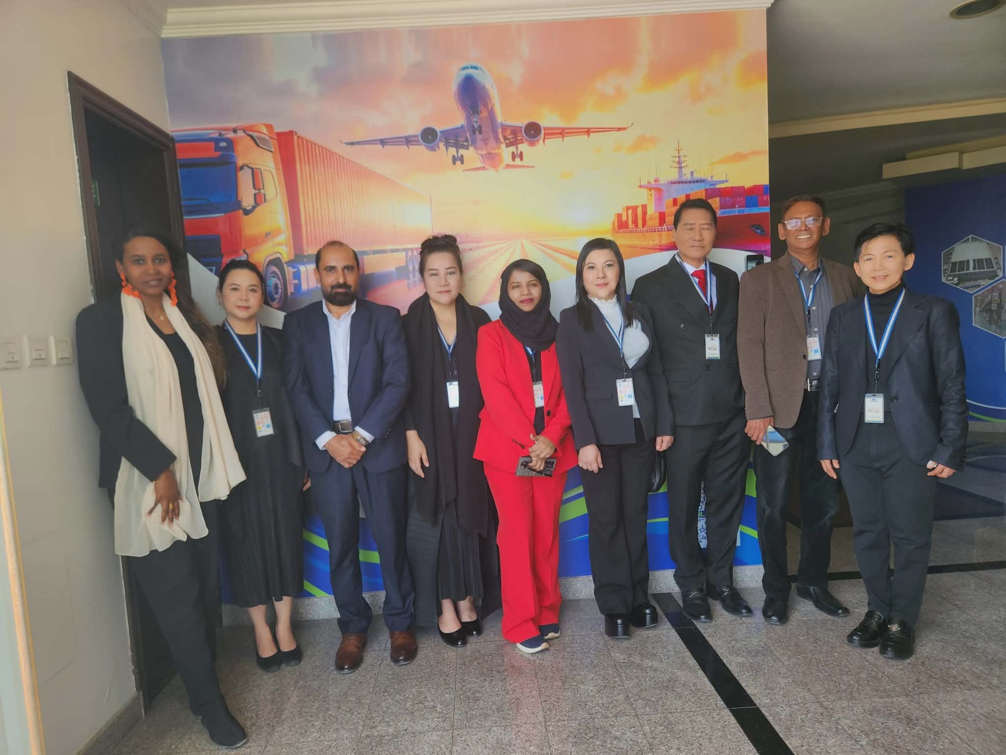Delegation group photo at ILSOMAN with SHEKINAIH SIEW SIN YAP and J AARON K DAVID before the cargo and aviation mural