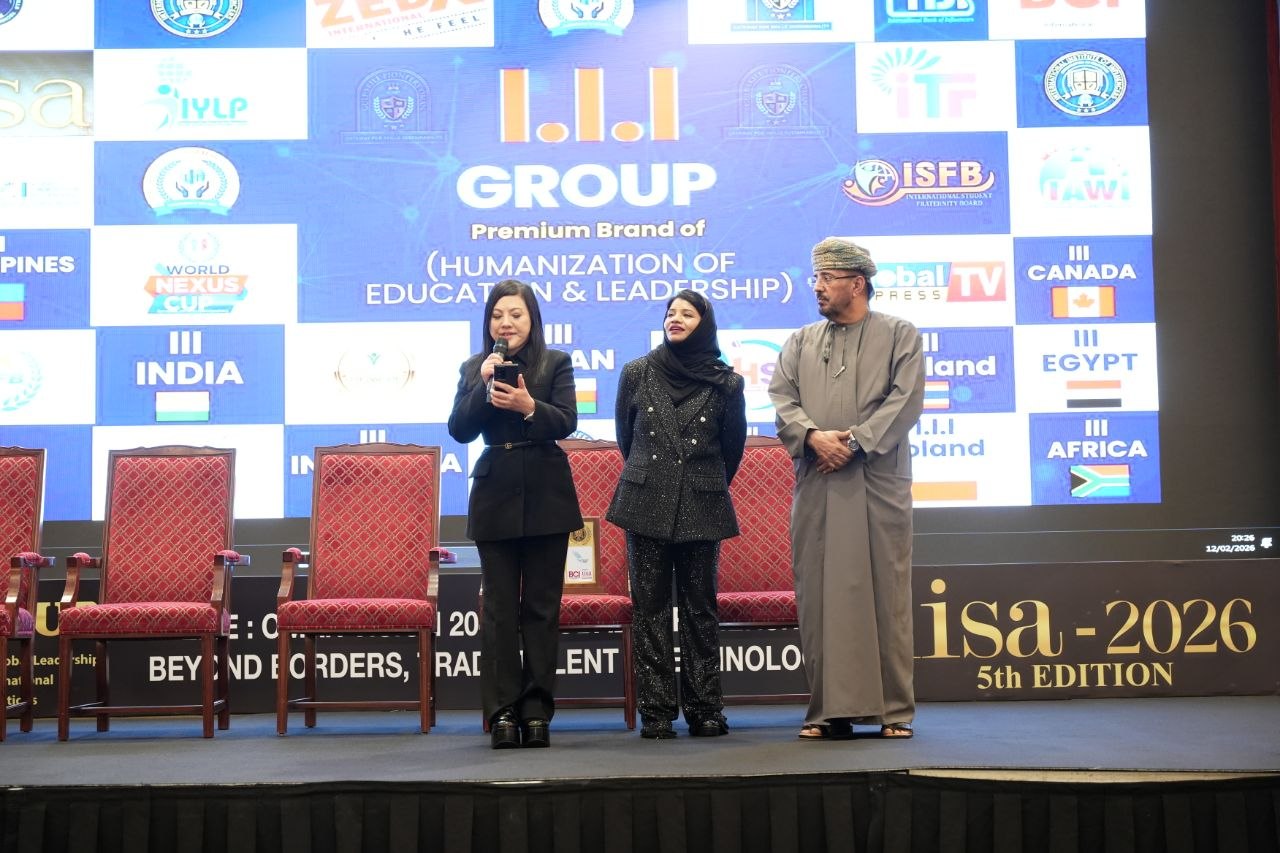 SHEKINAIH SIEW SIN YAP on stage at IISA 2026 with a representative in hijab and the Omani host delegate
