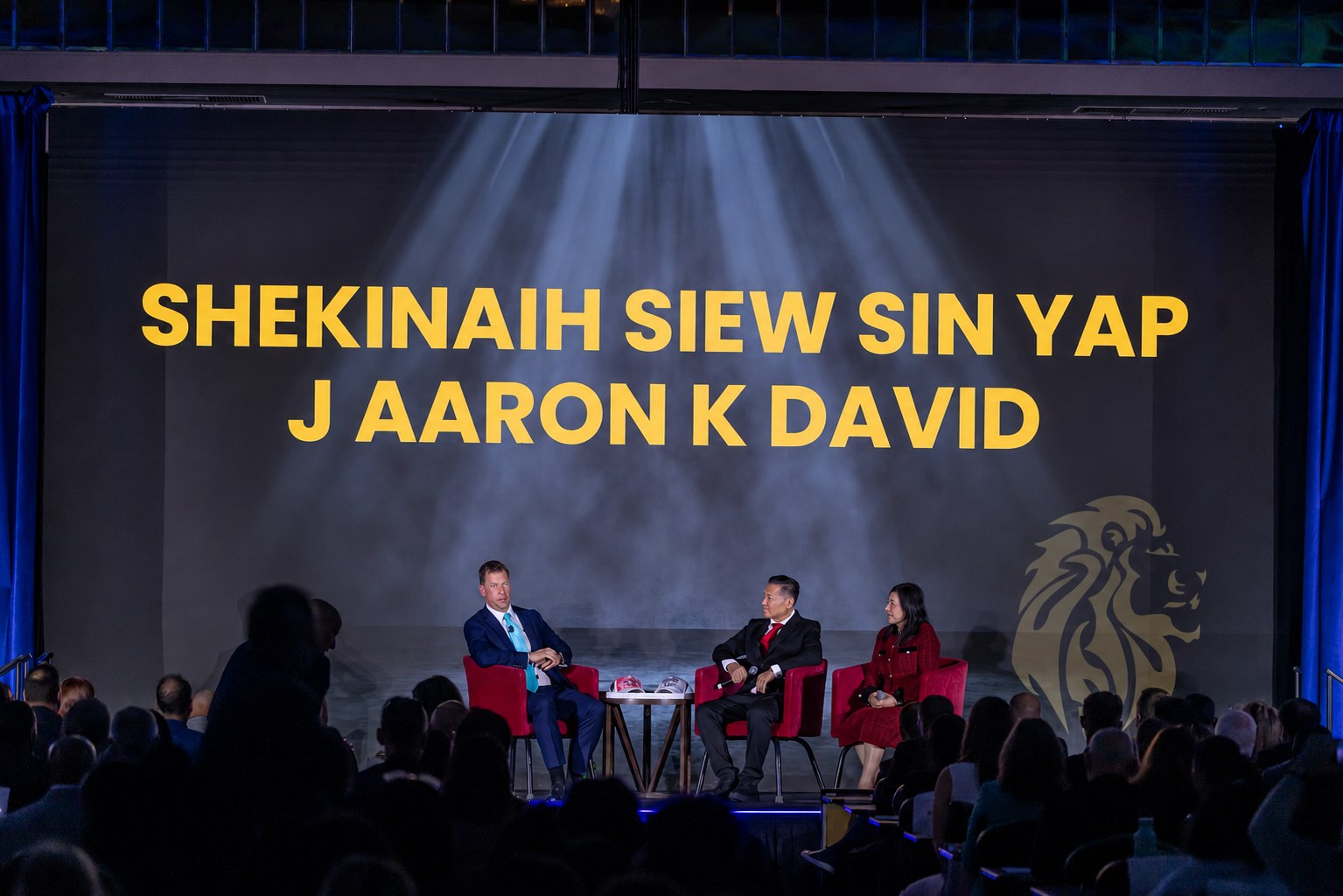 SHEKINAIH SIEW SIN YAP and J AARON K DAVID on the Mega Success 2025 main stage in Los Angeles, their names on the giant screen